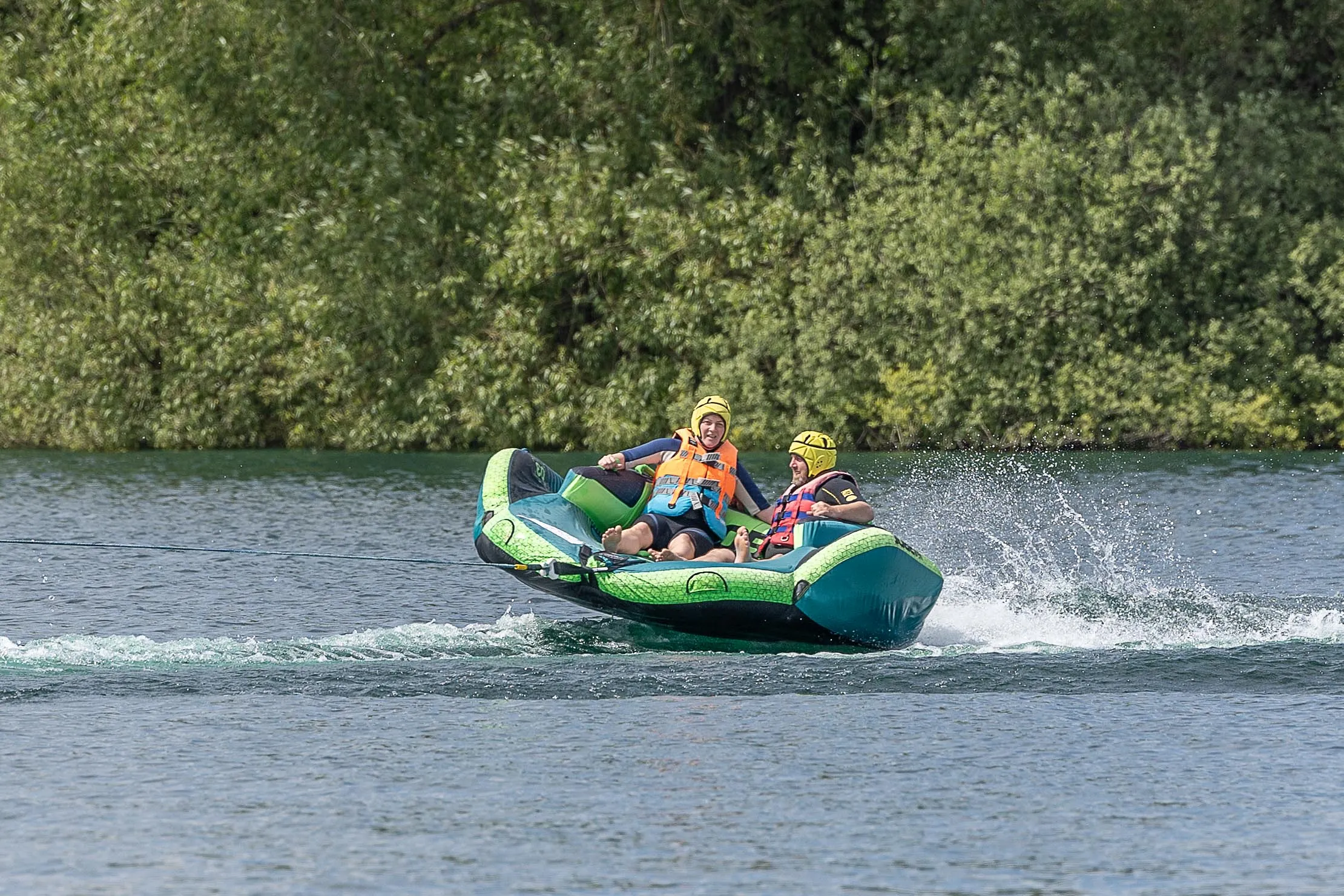 Enjoying inflatable rides on the Cotswold water park