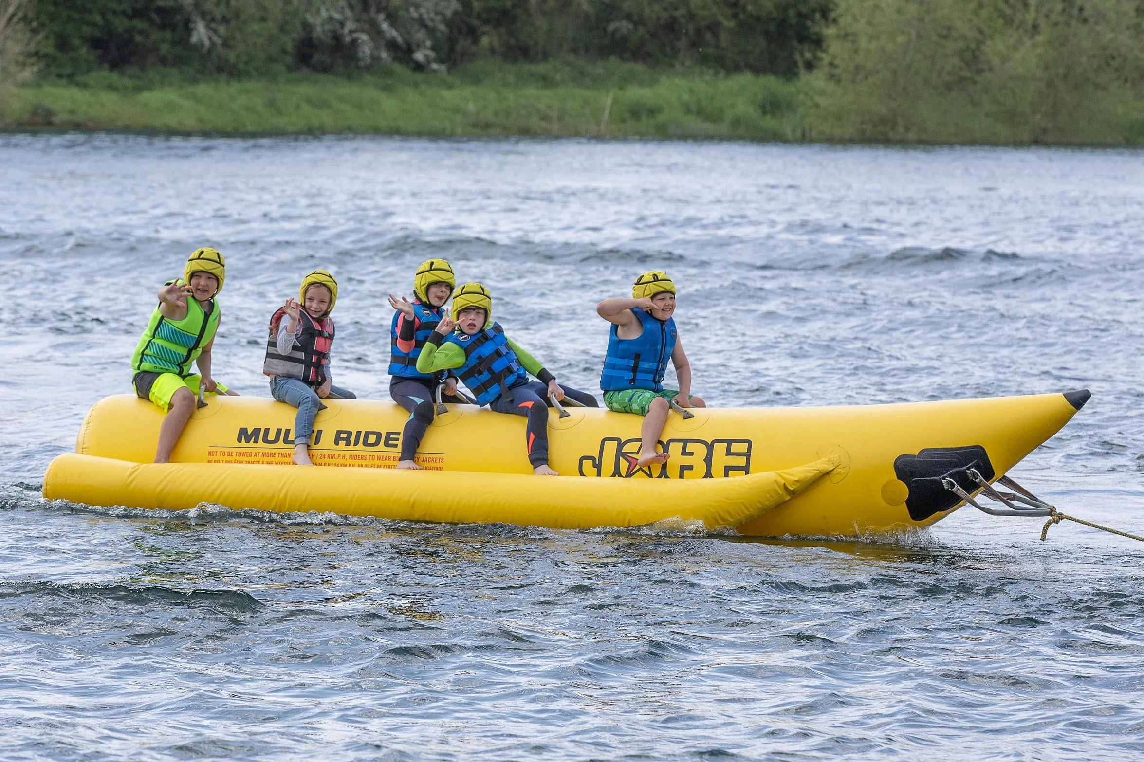 children having fun on an inflatable ride